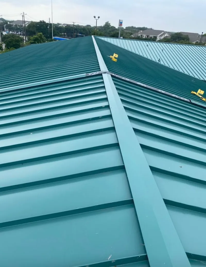 Green commercial metal roof ridge and valley for Metal Roof Repair in Post Falls